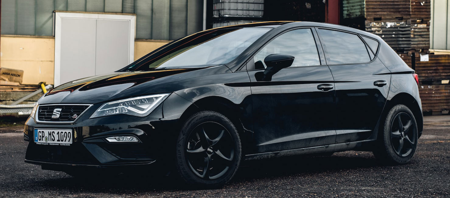 Black SEAT car in factory setting