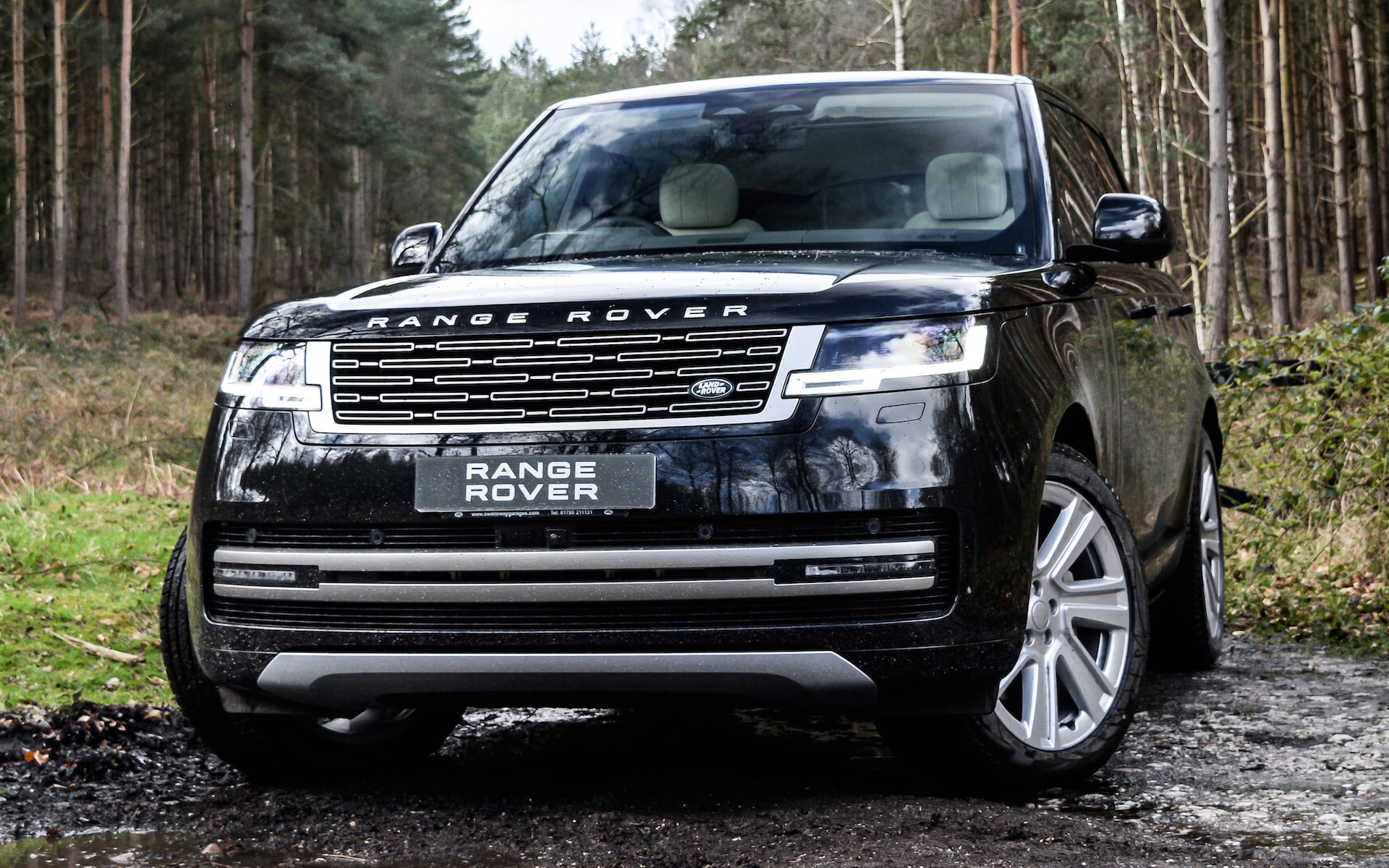 Black range rover car off road