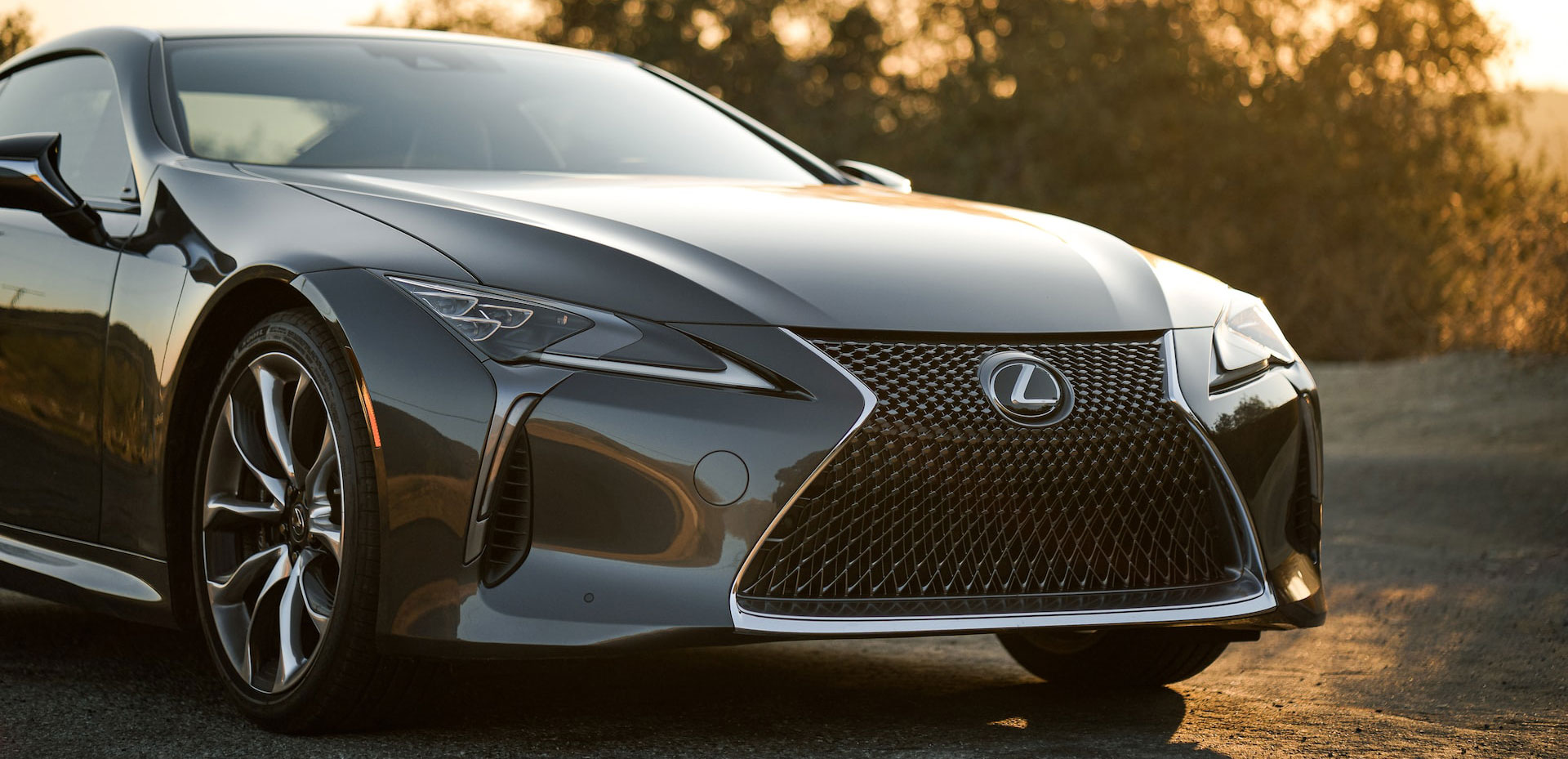 Grey Lexus car in the sunset